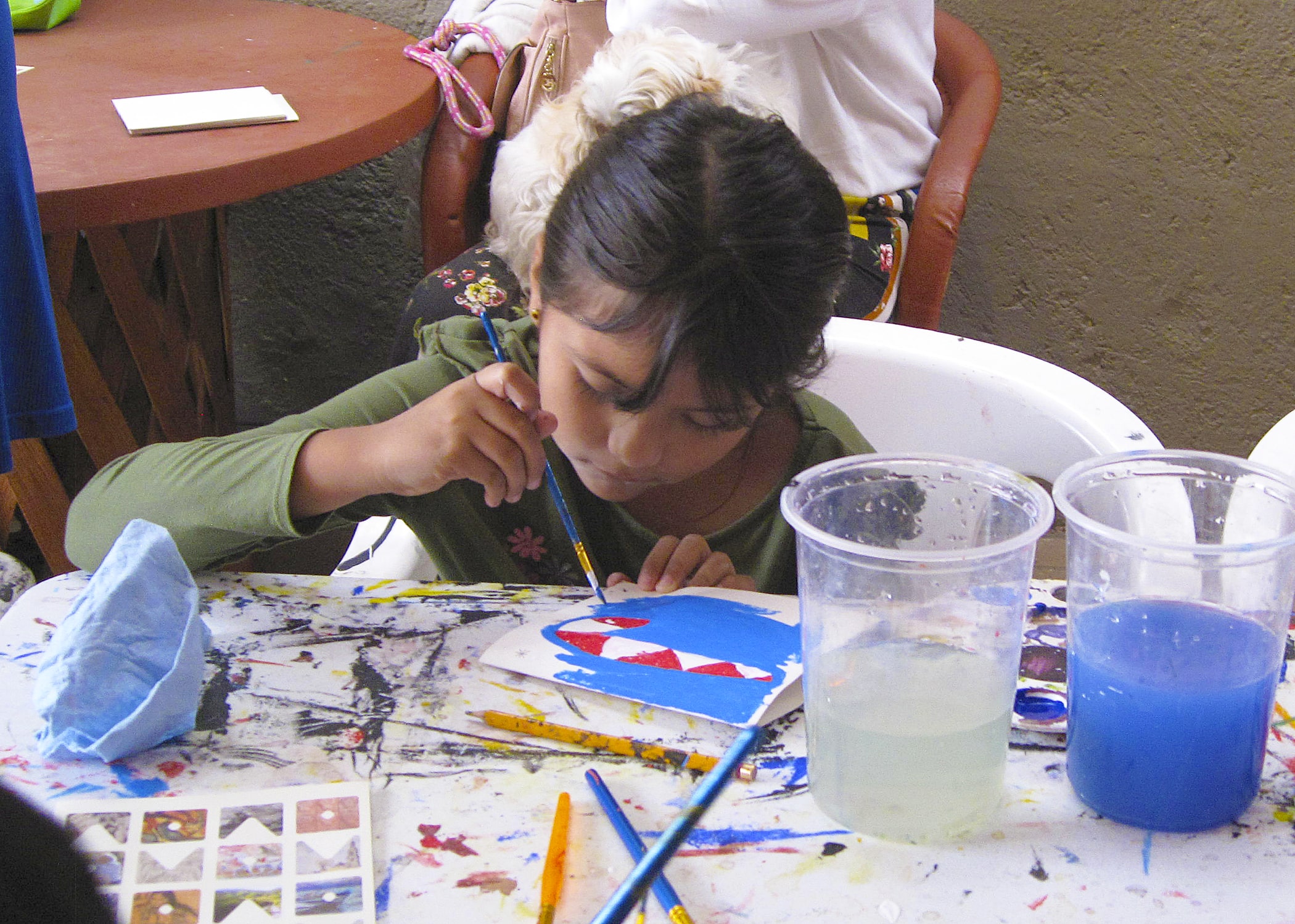 Young artist concentrating on her creation